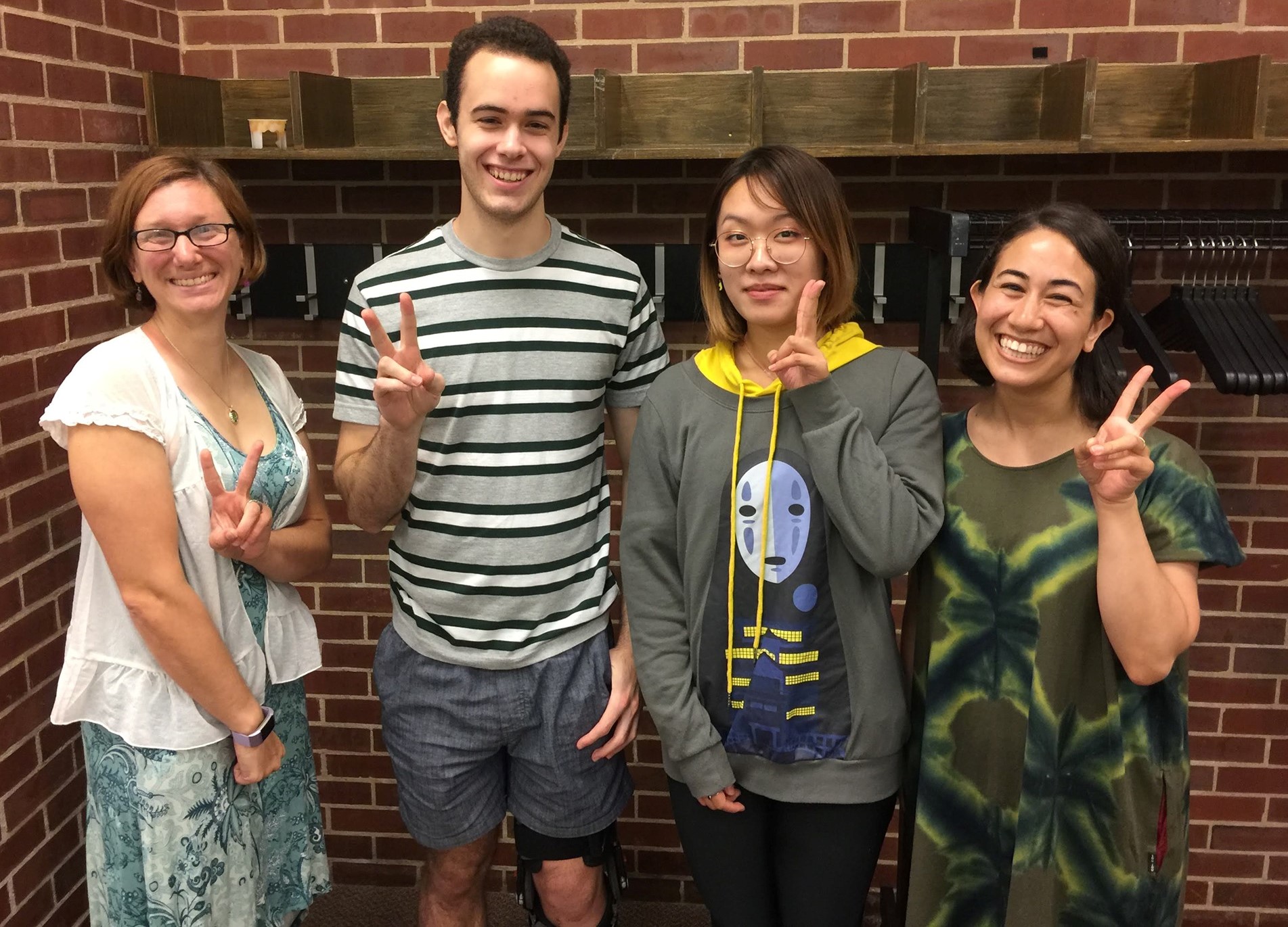 Four FLAS Recipients posing with peace signs