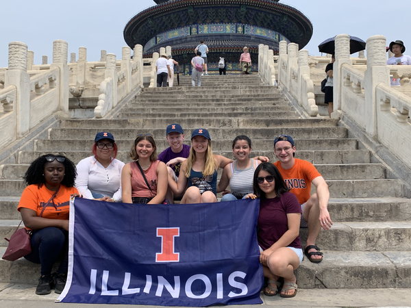 Wanxiang recipients holding an University of Illinois Flag on the steps of China's Temple of Heaven