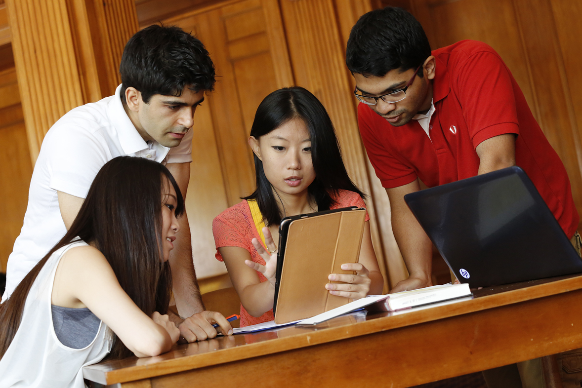 International students look at a tablet in the Illini Union South Lounge.