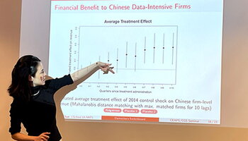 Dr. Meicen Sun presenting a slide